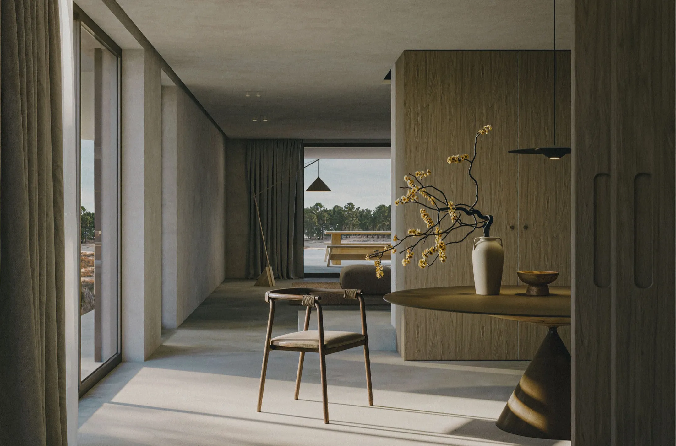 Interior with a wooden chair facing the window and the dunes