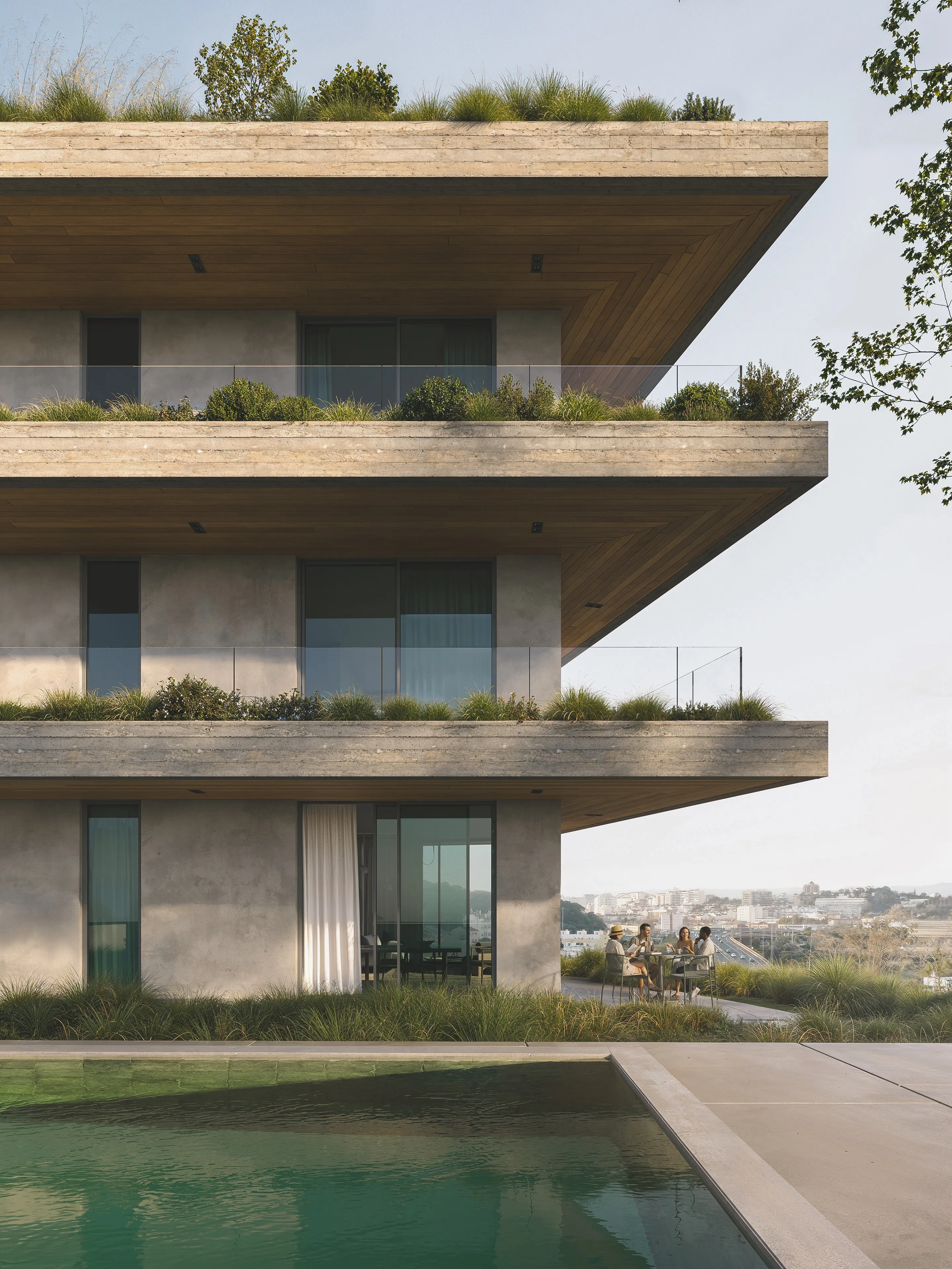 Concrete villa with planted terraces and a pool