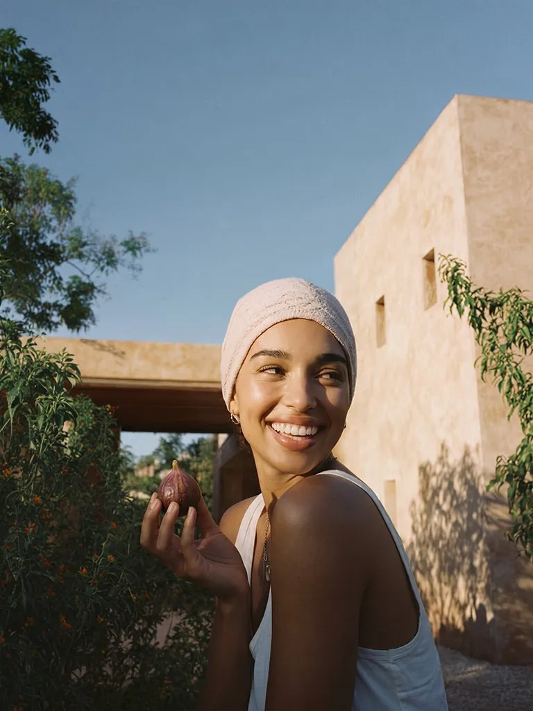 A woman smiling under the tree