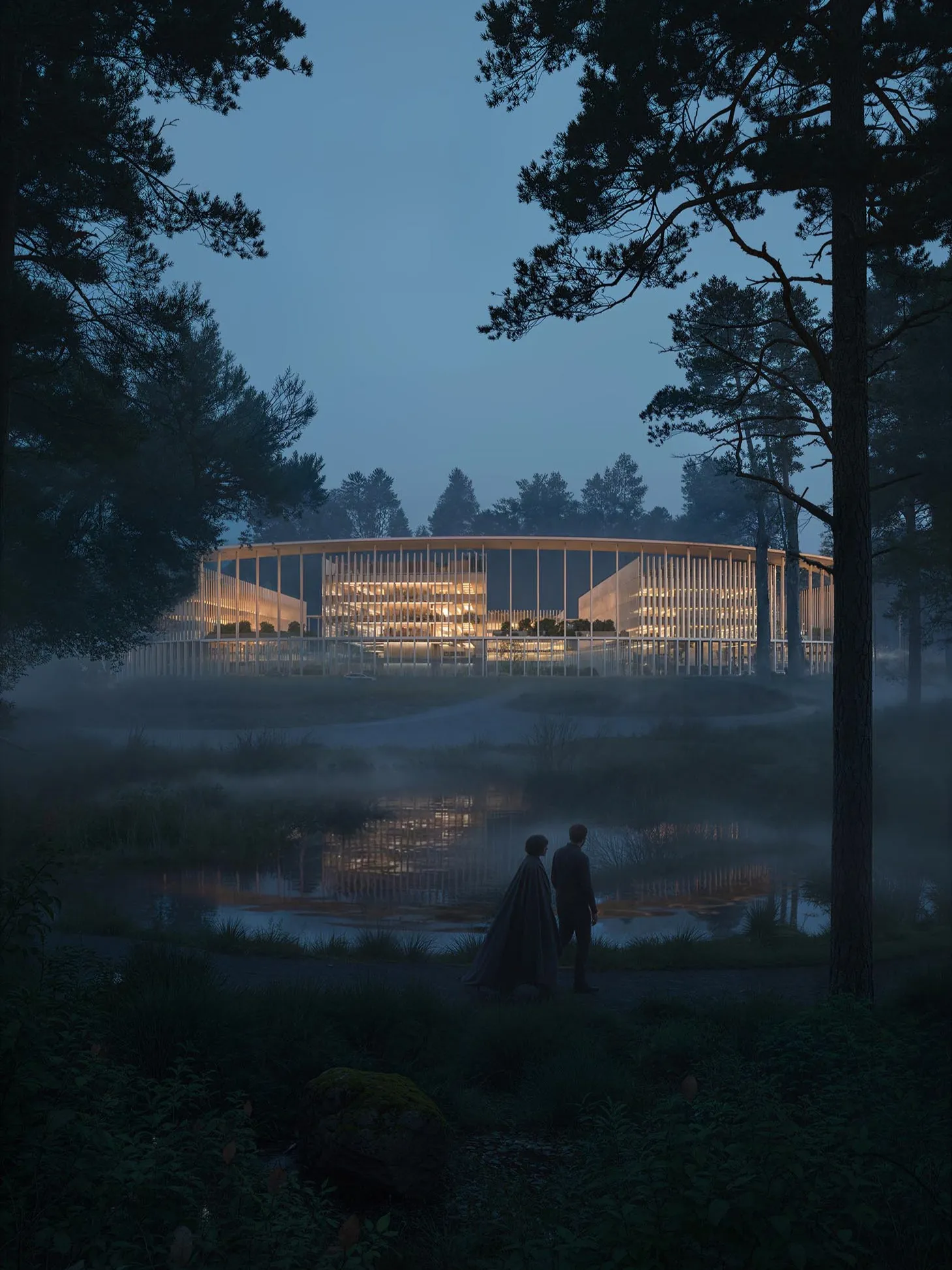 The building lit at dusk through the pines