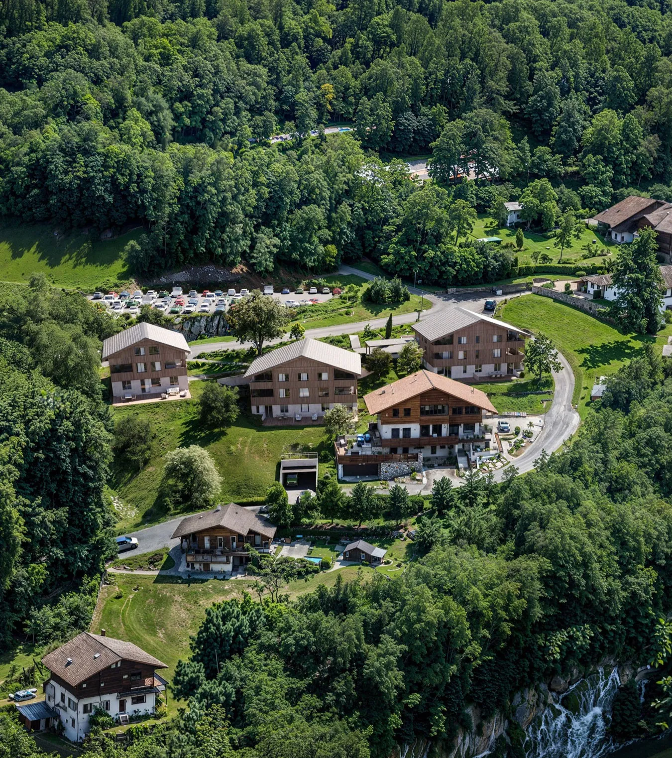 Chalets on a wooded hillside