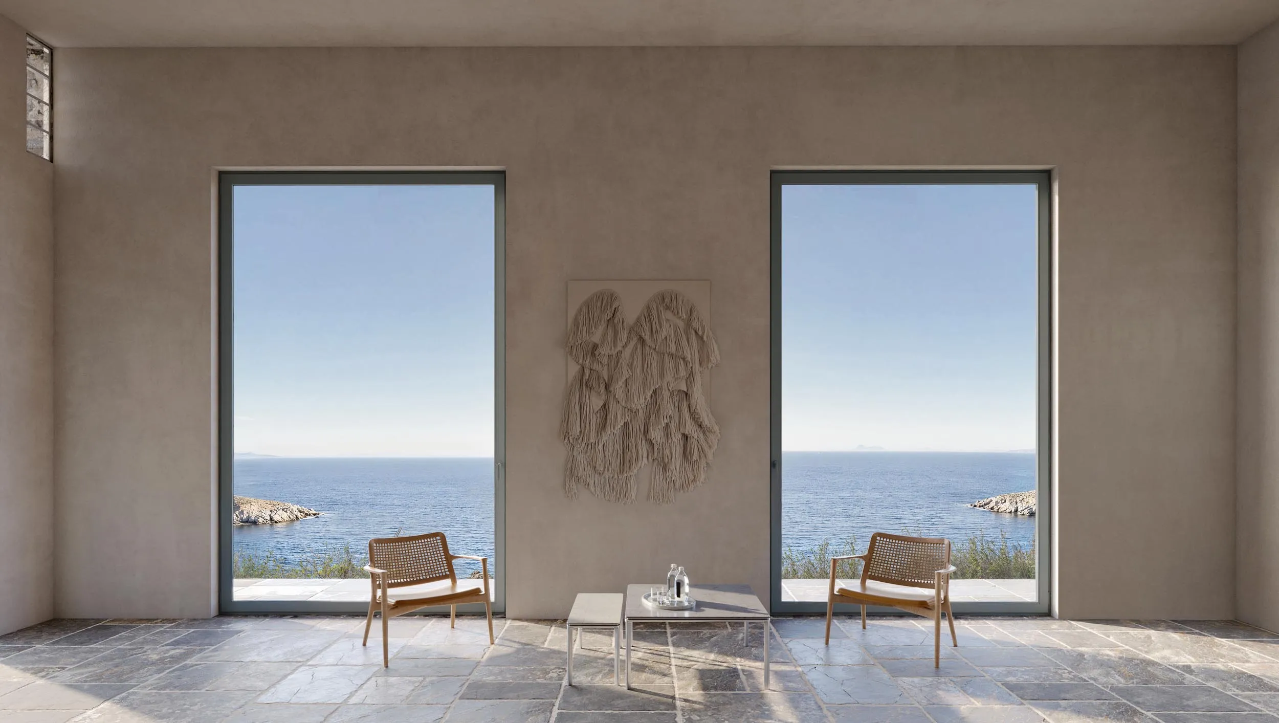 Living room with two windows on the sea
